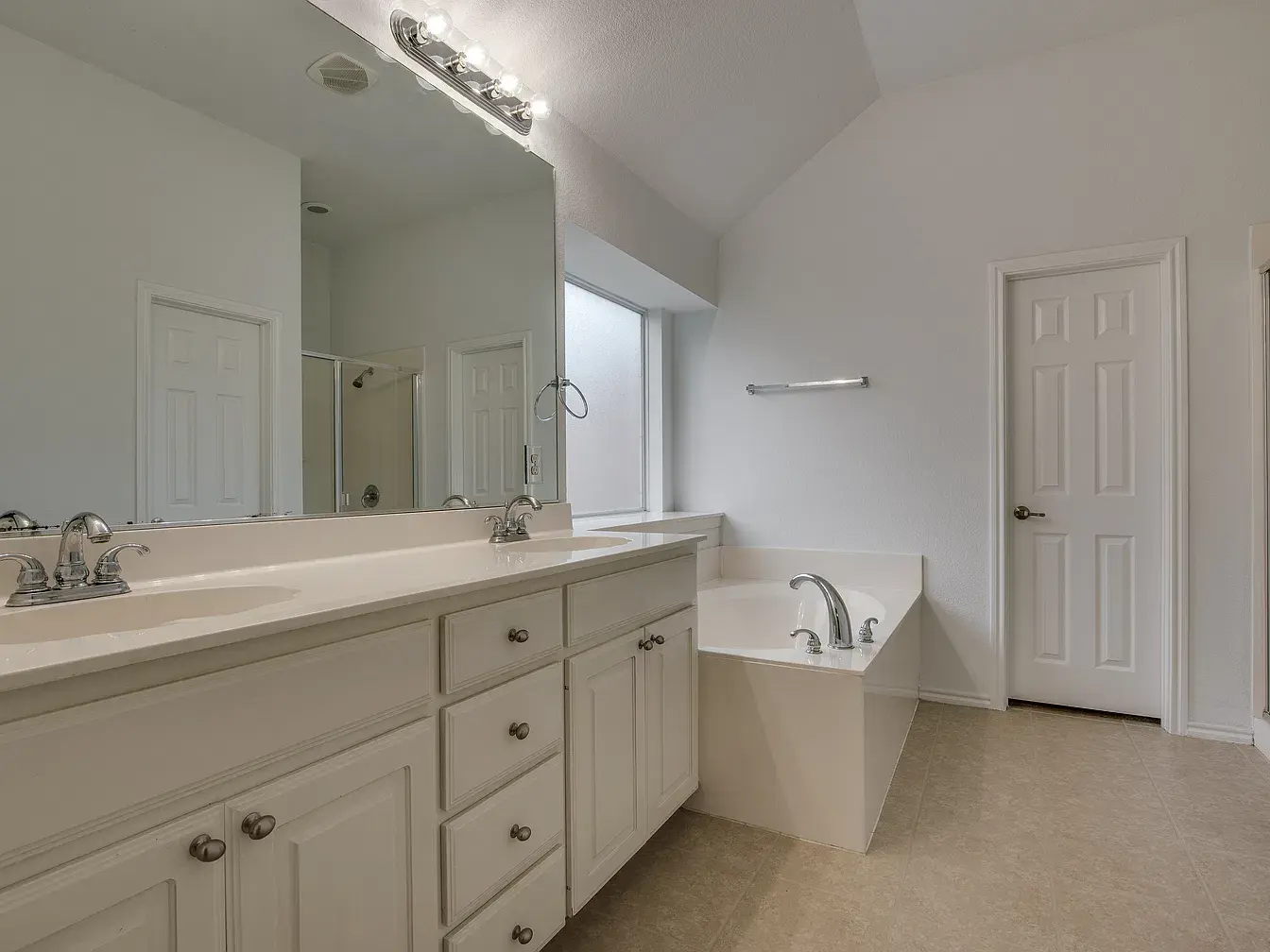 Primary bath with double vanity and soaking tub